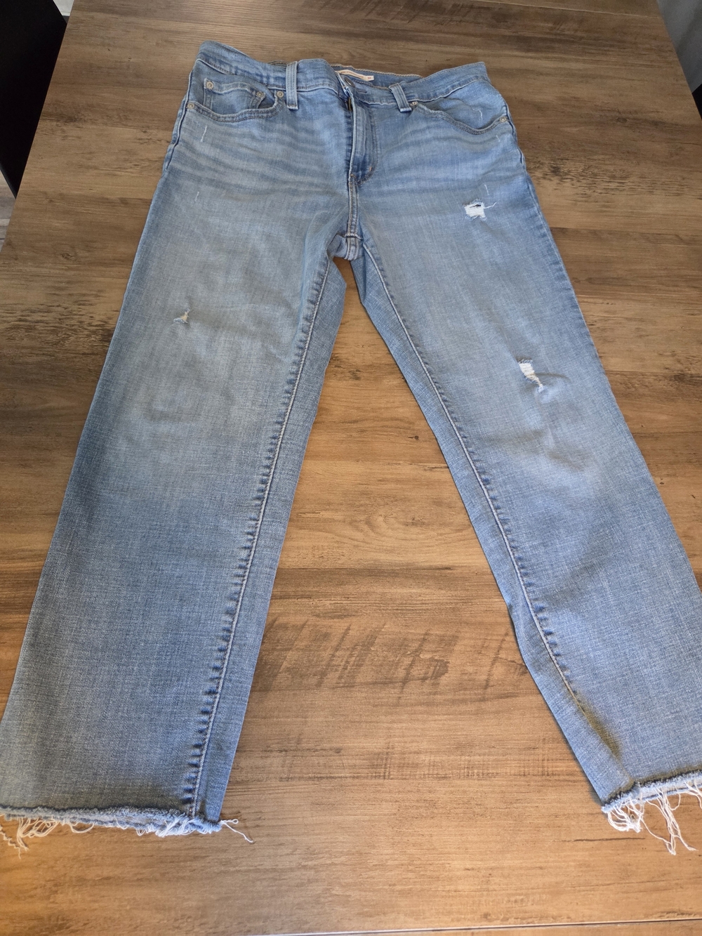 Levi's Light Blue Straight Leg Jeans with Distressed Details